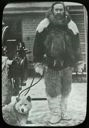 Image of Robert Peary in Furs with Dog on Deck of S.S. Roosevelt